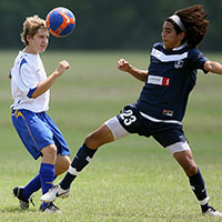 Young girls playing football